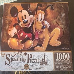 New never used Disney Puzzle from Disney parks. Pluto and Mickey.